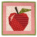 The completed Foundation Paper Piecing Series 4 September project, an apple in red, cream, and green fabrics, isolated on a white background. 