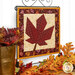 An angled shot of the project, displayed on a craft hanger and staged with coordinating foliage.