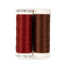 Two spools of rust red and mahogany thread, isolated on a white background.