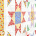 An angled close-up of the quilt featuring star patterns in red, blue, yellow, and purple fabrics.