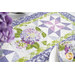 A stylized shot of the runner, staged with coordinating settings, napkins, and flowers.
