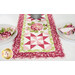 A closer look at one end of the runner, demonstrating details on the borders and pinwheel block.