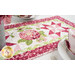 A stylized shot of the runner, staged with coordinating settings, napkins, and flowers.