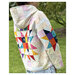 A model wears the Hoodie, showing patchwork details on the back star.