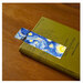 A digital mock-up of the completed Starry Night bookmark on a book to show scale and function. 