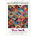 Front of the pattern with an image of the finished quilt in colorful colors with the designer name across the top and the pattern title in purple text across the bottom.