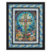 The completed Glory to God Quilt, featuring a stained-glass cross panel at its center and colorful stained-glass fabric borders from the Faith in Full Color collection by Henry Glass Fabrics, isolated on a white background.