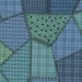 Blue-scale fabric ranging from navy to teal with many different patterns of flannel and dots. 