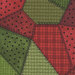 Red and green fabric in varying styles and shades with many different patterns of flannel and dots. 
