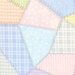 Multicolor pastel fabric in varying styles and shades with many different patterns of flannel and dots. 