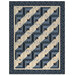 The finished Log Cabin Throw Quilt colored in navy, cadet blue, and soft beige fabrics from the Bluebird's Nest collection from Moda Fabrics, isolated on a white background. 