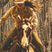 an 8x8 swatch of the panel featuring a cowgirl riding a horse with a wood grain background.