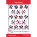 Front of the Fireworks Quilt pattern showing a digital mockup of the finished quilt in red, white, and blue. Red banners across the top and bottom of the pattern have the title and designer name.