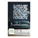 The front cover of the Lotus pattern, featuring a digital image of the finished quilt staged above furniture and decor.
