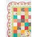 A super close up on the upper left corner of the quilt, demonstrating details on the fabric colors and scalloped border.