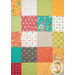 A head-on close up of the patchwork of the project, demonstrating fabric colors and print details.