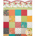 A super close up on the top of the quilt, demonstrating details on the fabric colors and scalloped border.