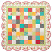 The finished Charming Picnic Quilt Kit completed in red, teal, orange and grey fabrics from the In The Garden collection, isolated on a white background.