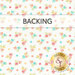 A swatch of white fabric with red, yellow, orange, green, and blue tossed flowers. A banner at the top reads "backing" and a golden Shabby Fabrics logo sits in the bottom right corner. 
