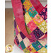 A super close up on the the bag and handle, demonstrating fabric prints and patchwork detail.