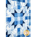 An angled shot of the center of the quilt, showing the patchwork block design of the quilt.