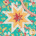 A top down image of the folding star at the center of the hot pads, showing patchwork detail and symmetry of the design.