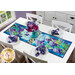 A white dining table staged with a the completed Iris in Bloom table runner, matching napkins, and a vase of coordinating flowers.
