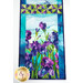 A close up on one end of the runner, showing color and print details on the iris print as well as the patchwork pinwheels.