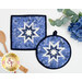 The completed Folded Hot Star Pads in dark blue, blue, and light blue fabrics from the Blue Belle collection by Maywood Studio, staged on a white table with coordinating decor.