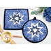 The completed Folded Hot Star Pads in dark blue, blue, and light blue fabrics from the Blue Belle collection by Maywood Studio, staged on a white table with coordinating decor.