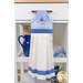 The completed Hanging Towel Kit colored in dark blue, blue, and white fabrics from the Blue Belle collection by Maywood Studio, hung on a drawer surrounded by coordinating décor. 