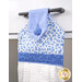 A close up on the top of the towel, demonstrating fabric colors and button closure detail.