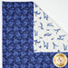 The cloth napkin laid flat on a table dark blue side up with the corner folded over showing off the white floral side.