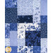 A super close up on the patchwork center of the quilt, demonstrating fabric, piecing, and top quilting details.