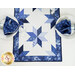 A top down shot of the end of the Floating Stars table runner, demonstrating the quilted star design. 