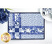 A top down close up of one of the Fat Quarter Shuffle Mats, demonstrating the white and blue fabric colors. 