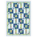 A colorful quilt featuring a geometric pattern of blue and floral squares with white accents.