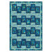 A quilt design featuring a pattern of dark blue rectangles on a light blue background with floral motifs.