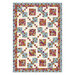 Colorful quilt featuring floral patterns and alternating square blocks on a light blue background.