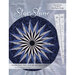 The front of the Star Shine pattern featuring a finished table topper and the Ten Degree Wedge needed for the project.