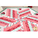 A closer look at the topper, showing details on the fabric prints and colors.