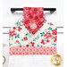 A close up on the top of the towel, showing details on the floral prints, tab, and fabric button.