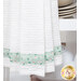 A close up on the bottom of the towel, showing details on the green floral stripe.