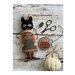 Image of the completed project "Nettle" featuring a masked rabbit and a pumpkin bucket needle book.