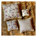 Image of the 4 completed pincushion projects with a woven basket background.