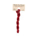 A skein of deep red embroidery floss, twisted and bundled, with a tan label featuring the brand name and color information.