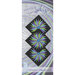 The front of the pattern, showcasing the finished runner on a mottled background.