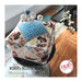 Image of completed project featuring dogs, canine themed items, a houndstooth wool square, and woof pins.