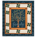 The completed Family Tree Patchwork Panel Quilt, colored in blue, cream, and brown fabrics from the Family Tree collection by Moda Fabrics, isolated on a white background.