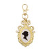The Jane Austen Silhouette Charm, with a black silhouette surrounded by a gold frame. Isolated on a white background.
